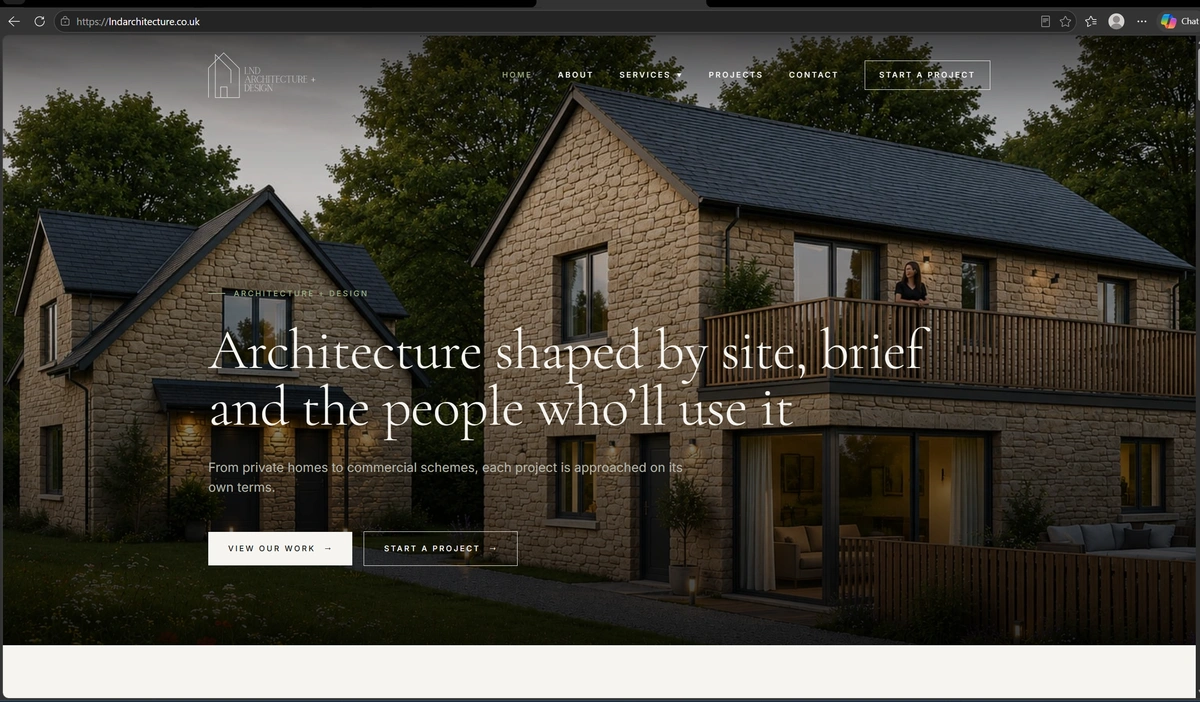 Homepage of lndarchitecture.co.uk: a full-screen evening photograph of two new stone houses with slate roofs and a timber balcony, overlaid with the headline Architecture shaped by site, brief and the people who'll use it.